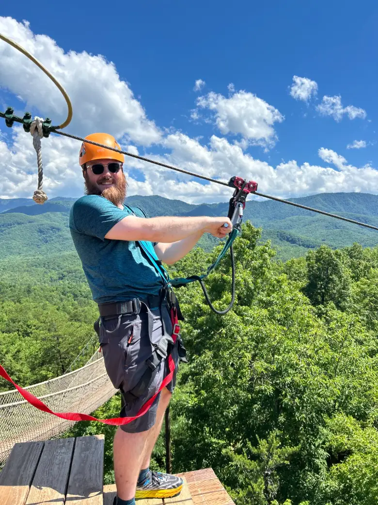 Glenn Williams on a zipline platform in the Smoky Mountains